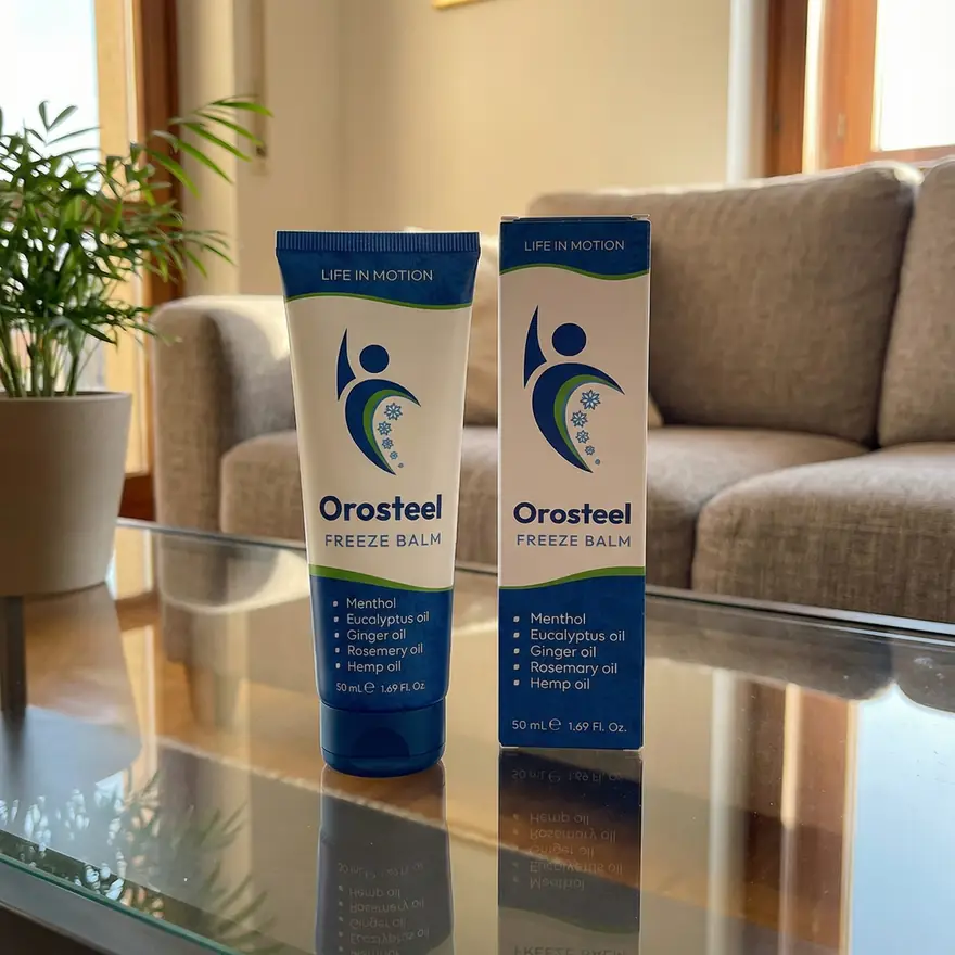 Tuba a krabička Orosteel Freeze Balm na skleněném stolku v obývacím pokoji